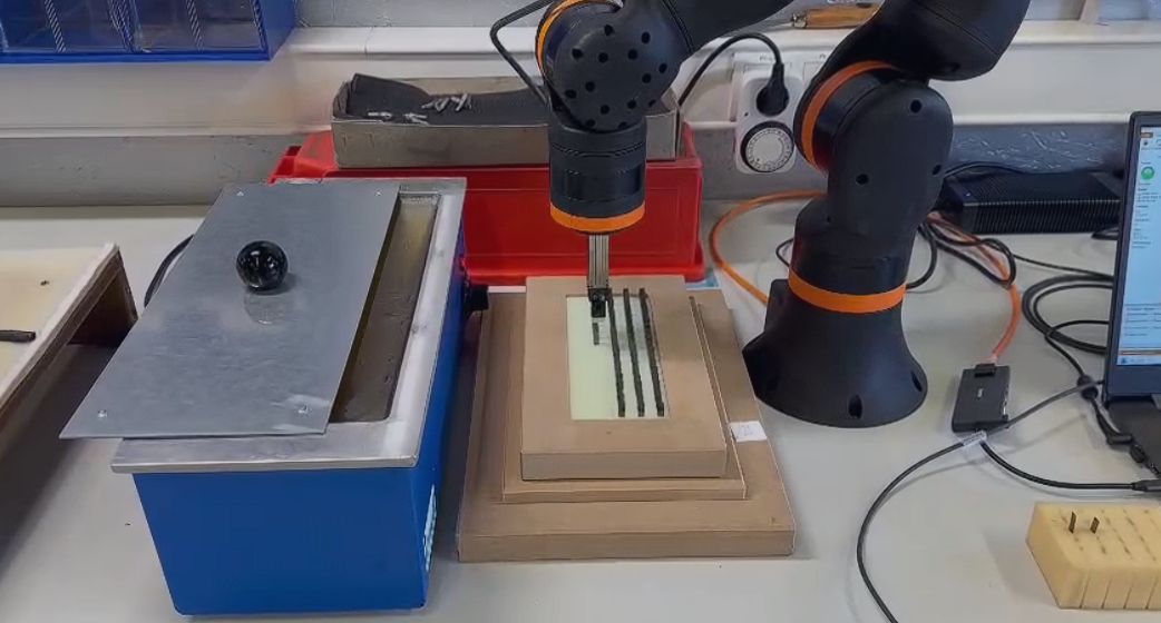 Precision cutting blade dipping process with ReBeL robot and Schunk gripper